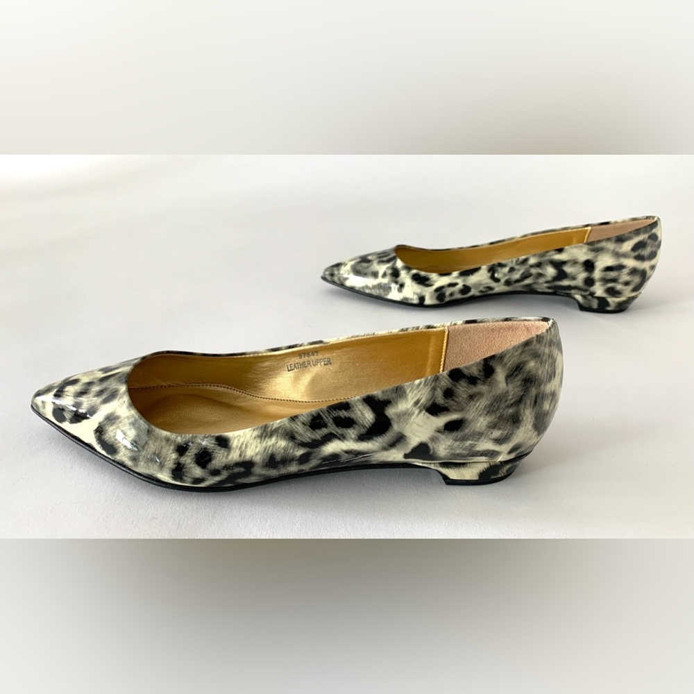 J. Crew pointed toe flat in patent leather. Unique black and cream animal print.